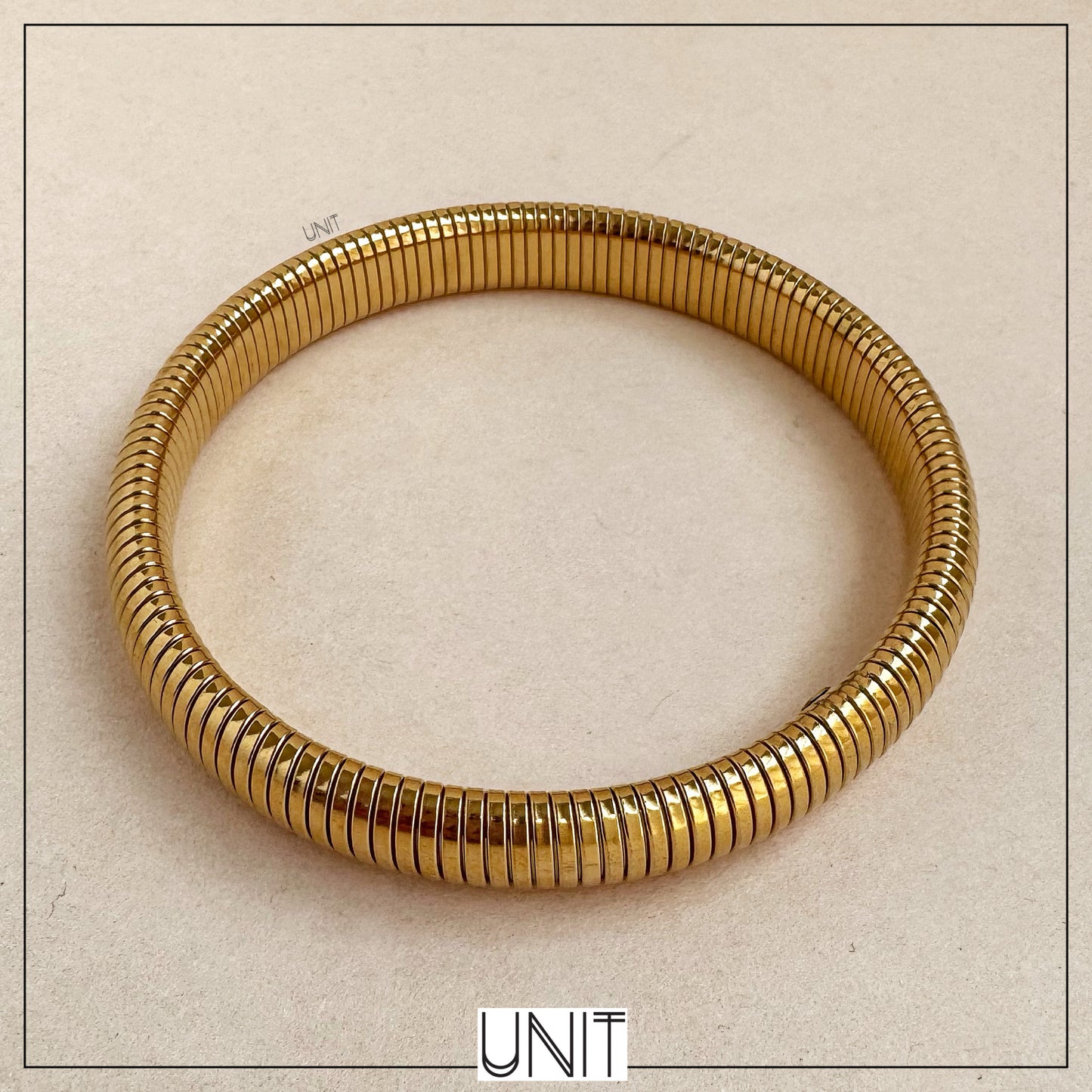 Solene Ribbed Gold Coil Bangle