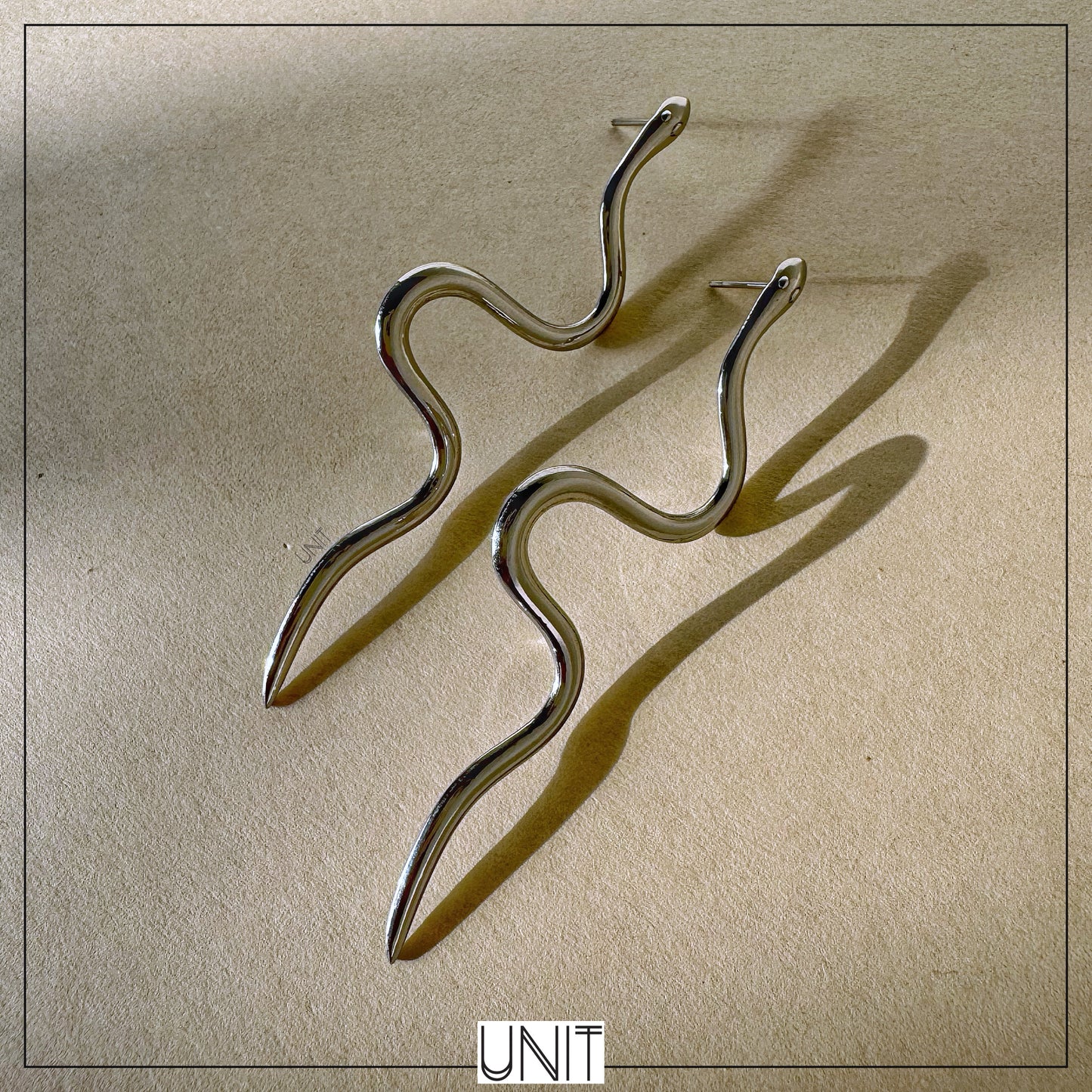 Seren Wave Drop Silver Earrings